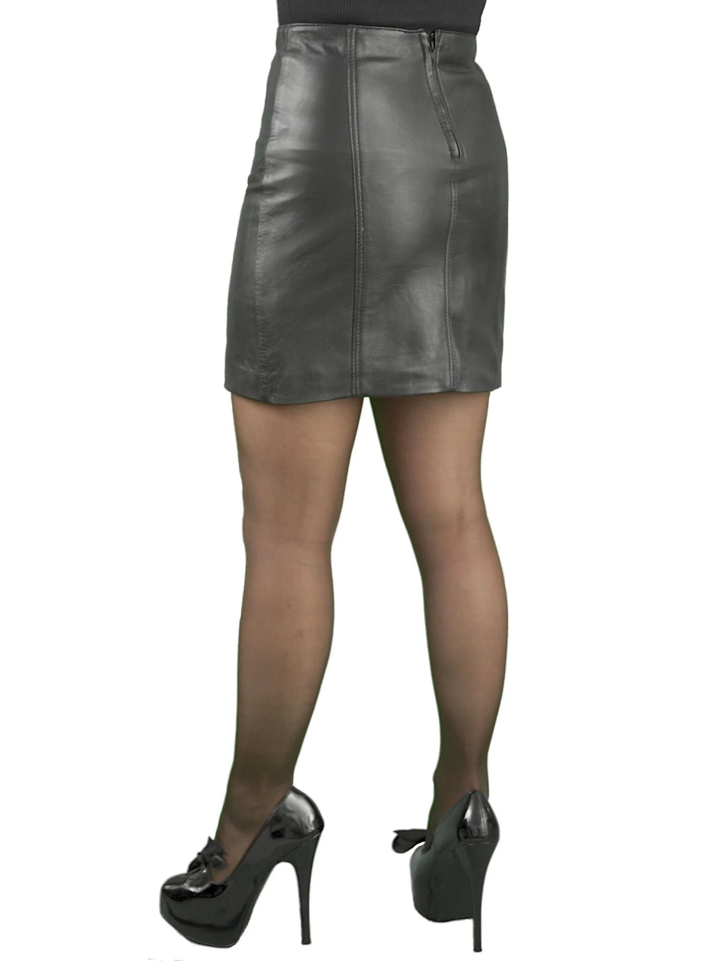 Person wearing a gray leather skirt and black high-heeled shoes on a white background