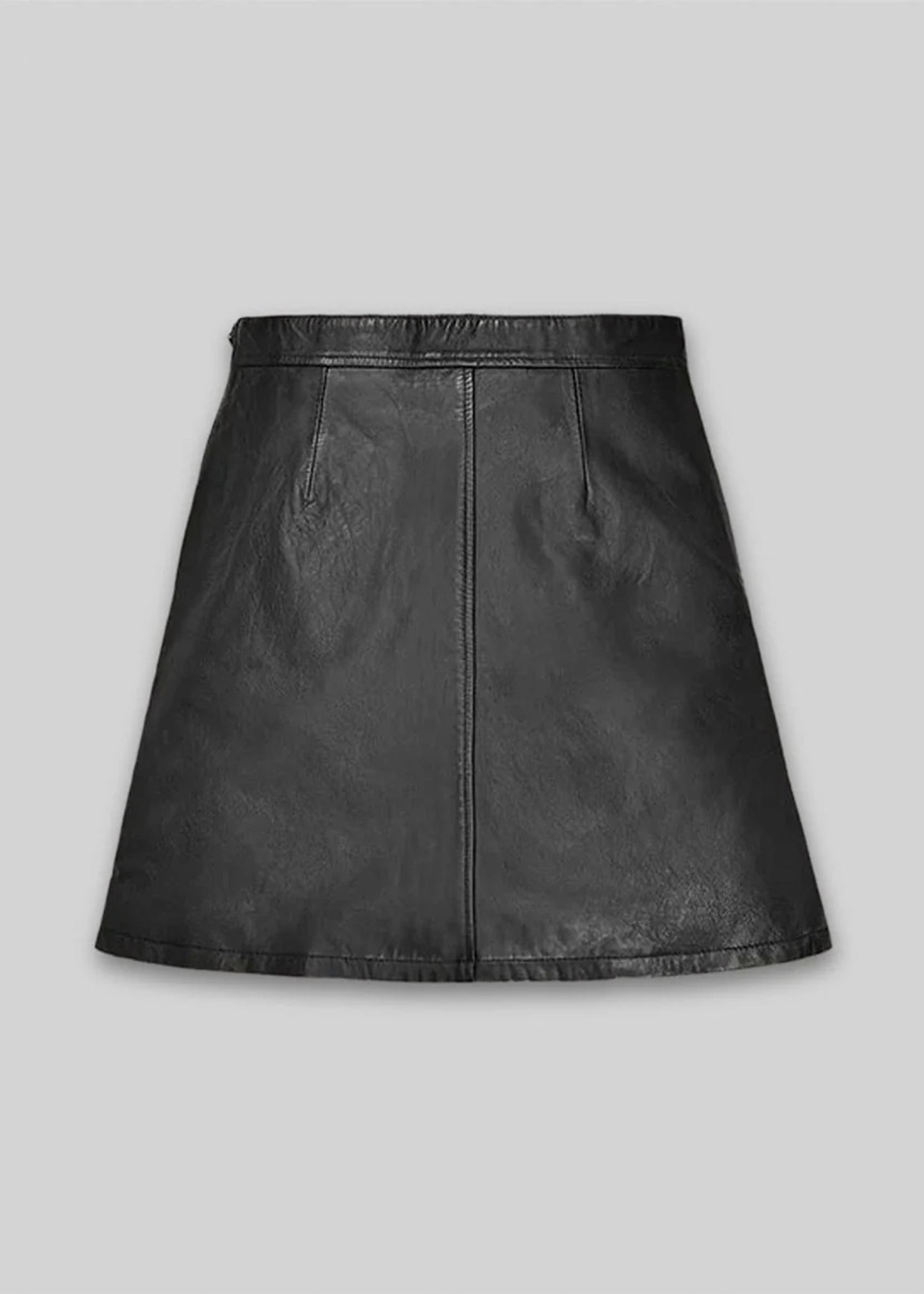 Black leather skirt on a gray background