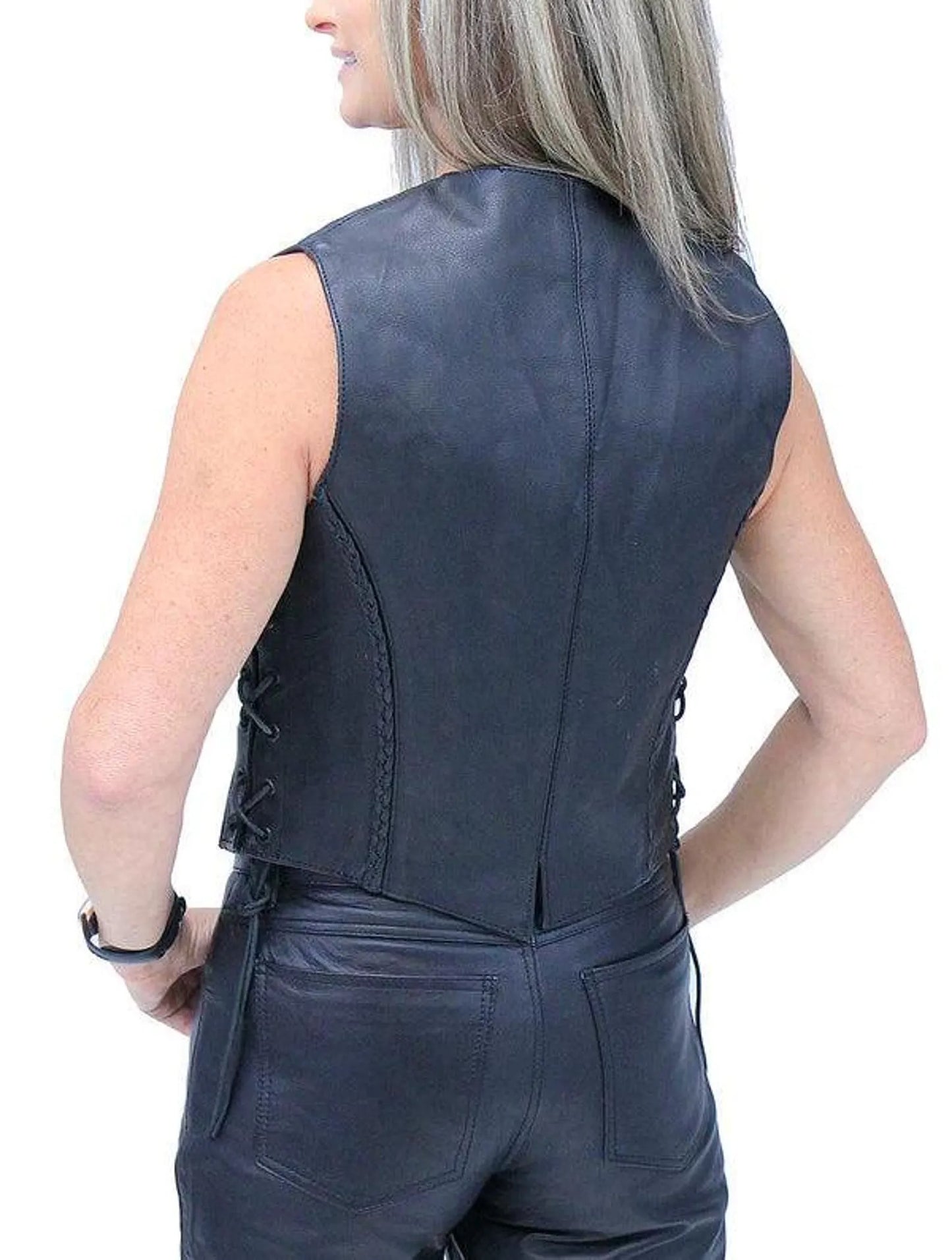 Person wearing a black leather vest on a white background