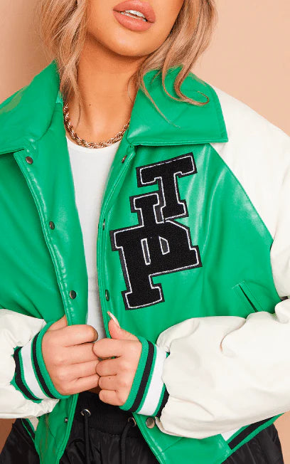 Green varsity jacket with a large black letter 'P' on a beige background