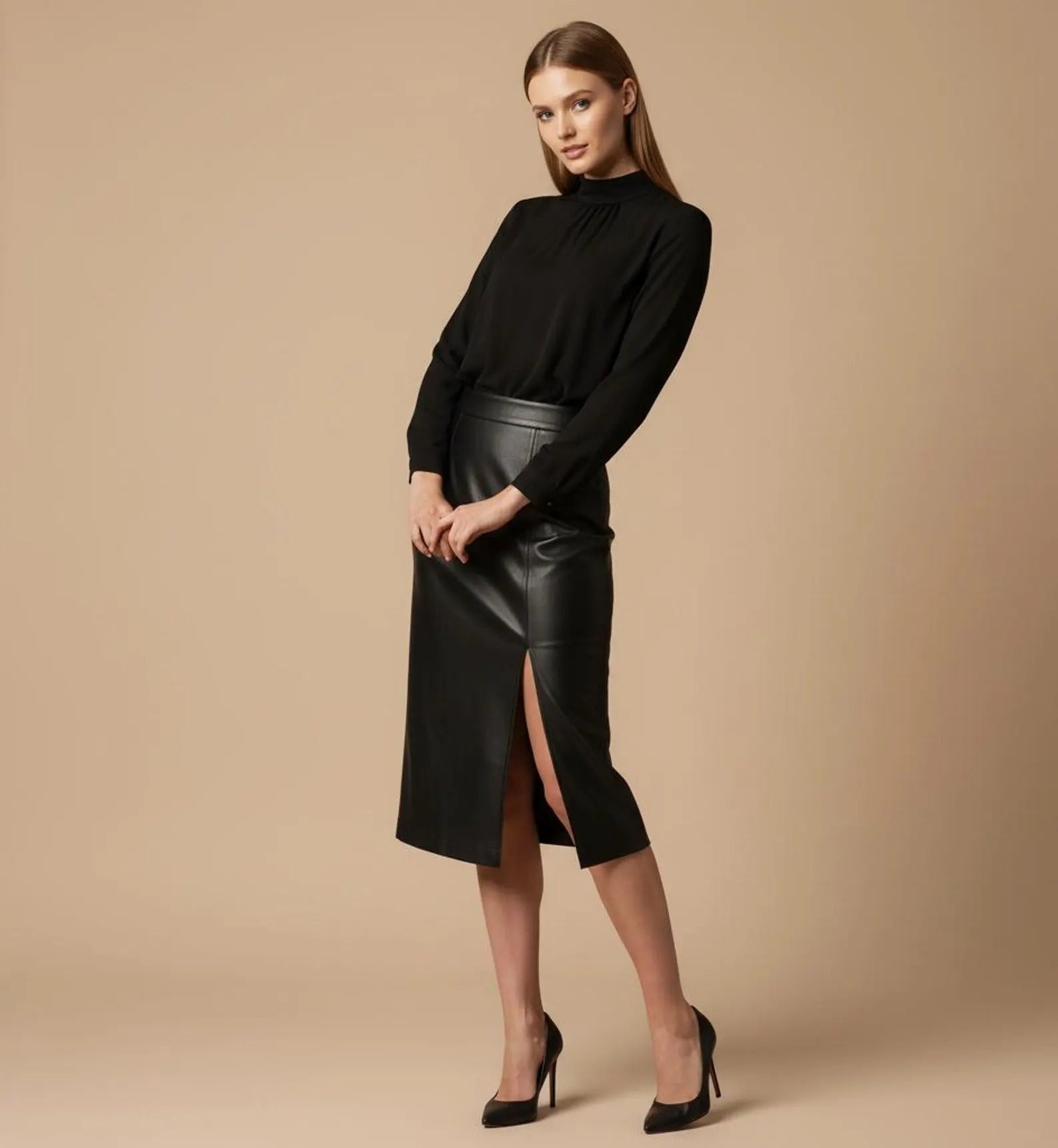 Woman wearing a black turtleneck and leather skirt on a beige background