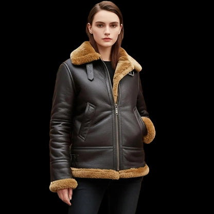 Woman wearing a black leather jacket with brown fur trim in an indoor setting.