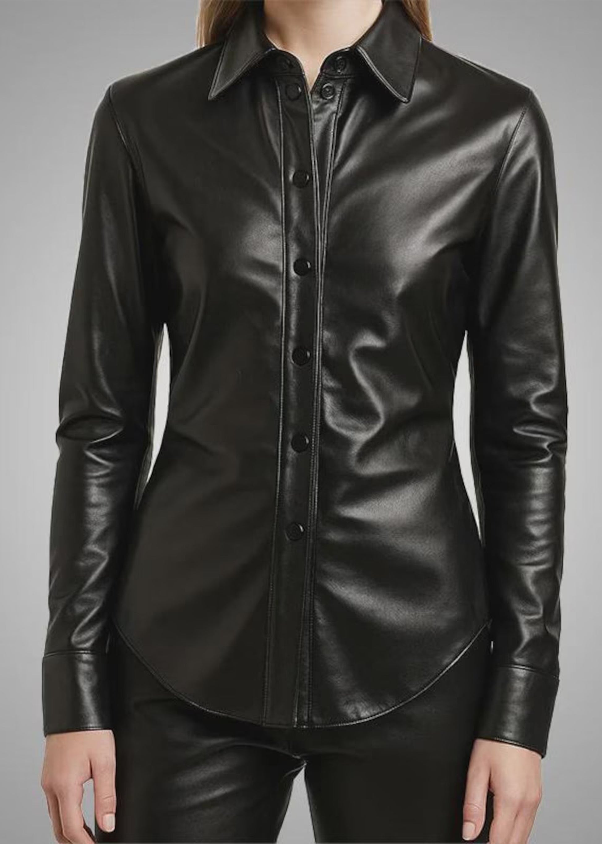 Black leather shirt worn by a person on a gray background