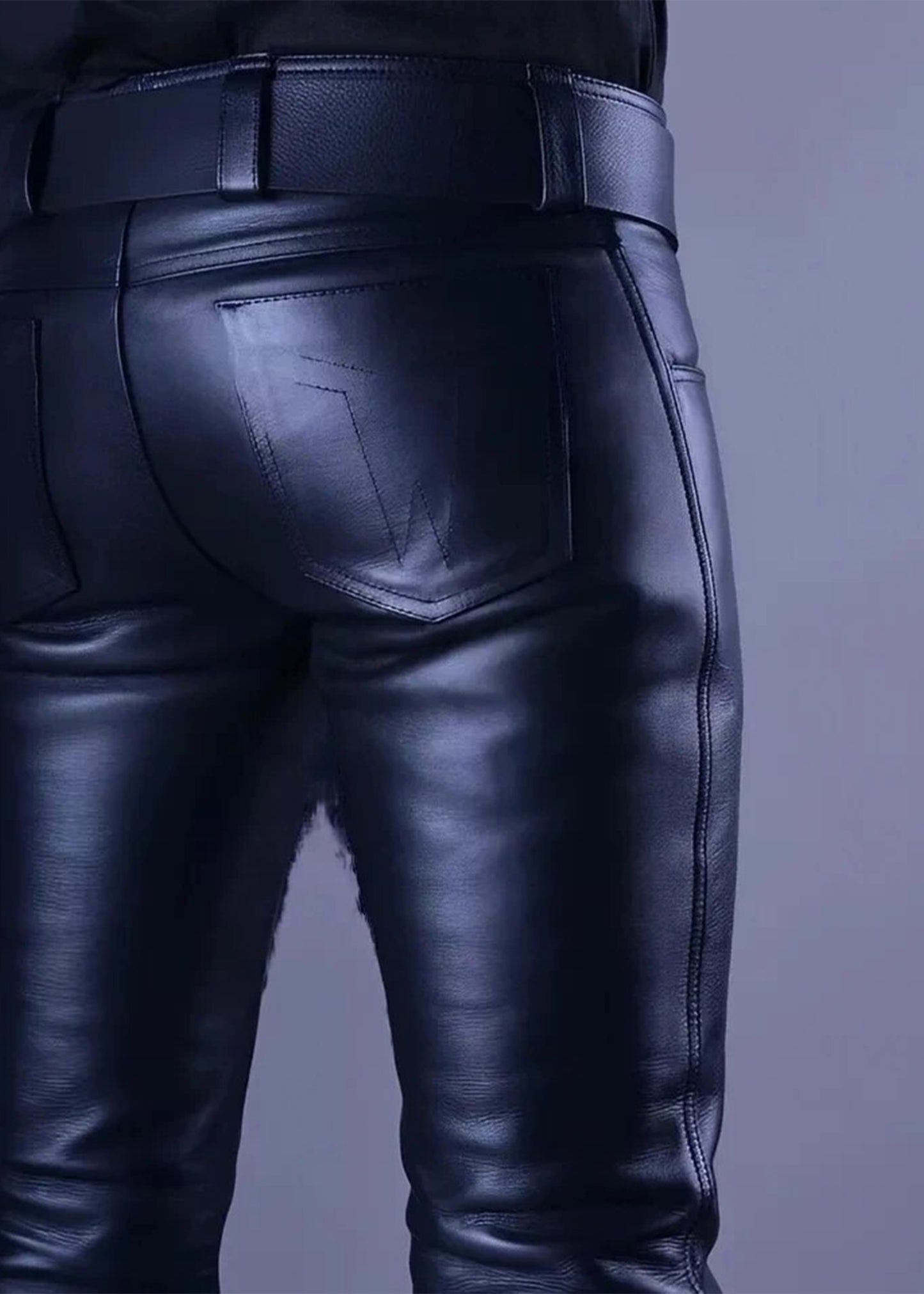 Black leather pants on a plain background
