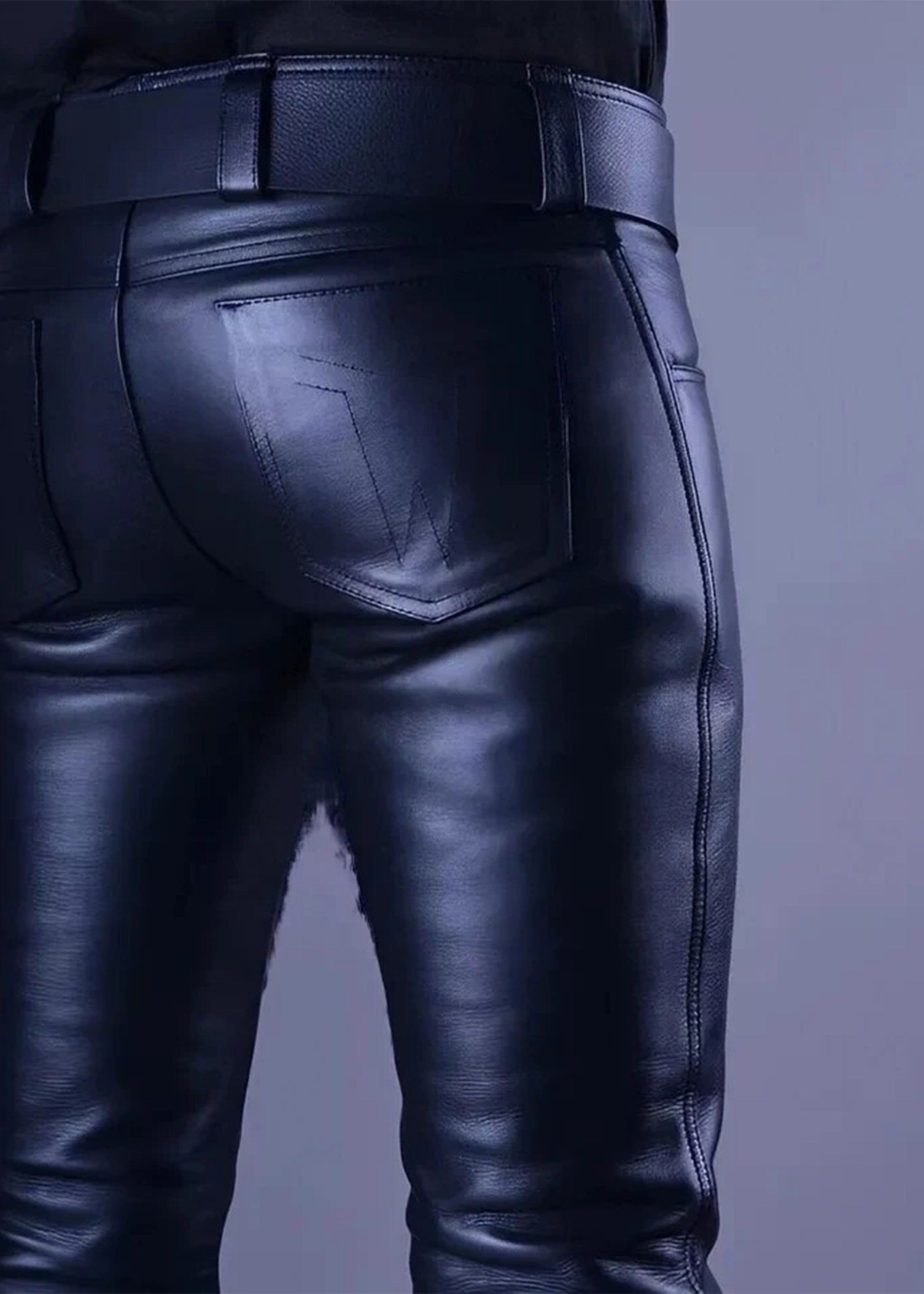 Black leather pants on a plain background