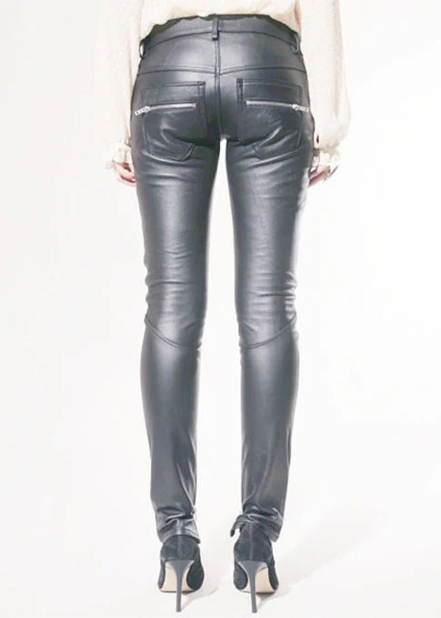 Gray leather pants worn by a person on a white background