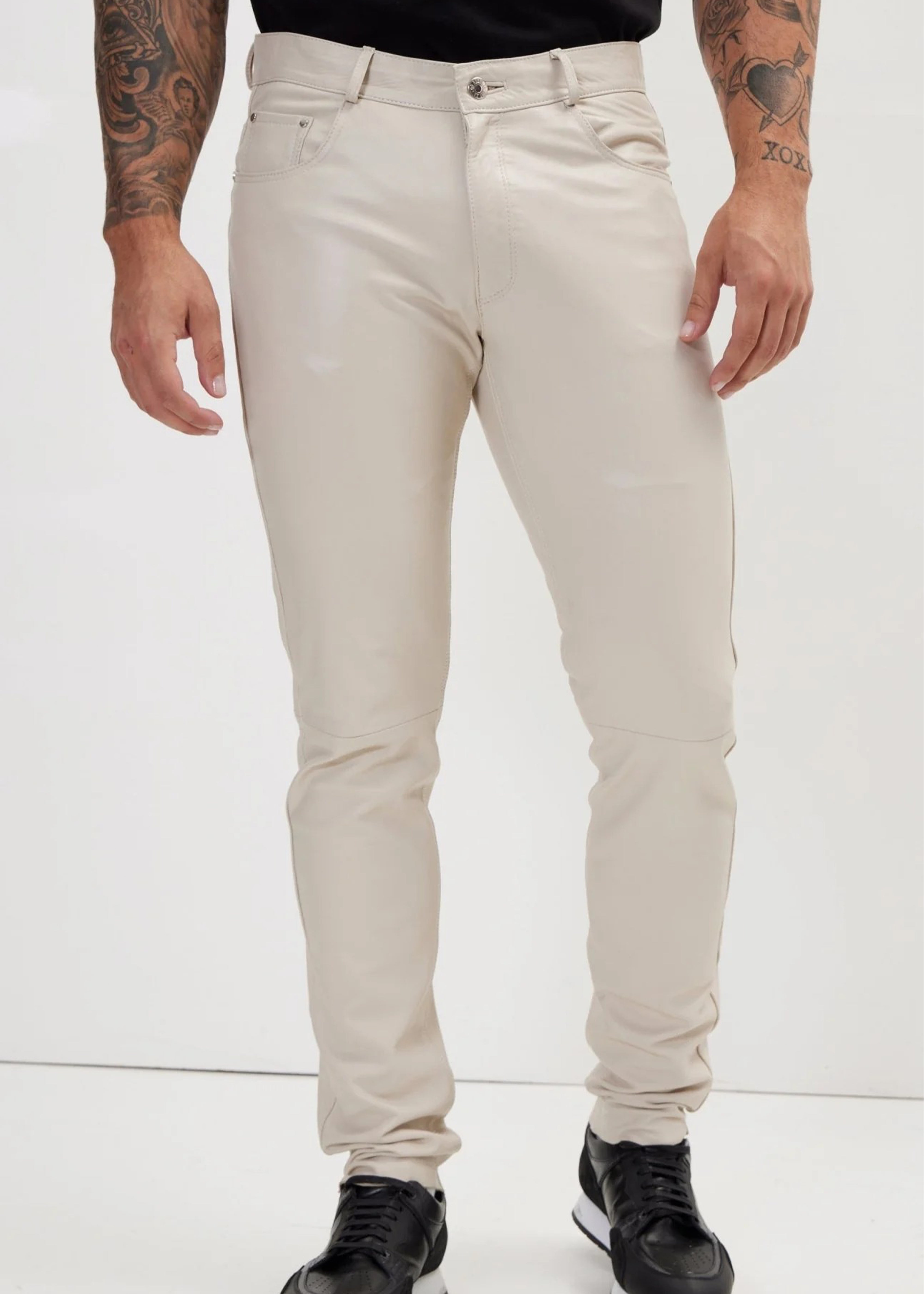 Person wearing beige pants on a white background