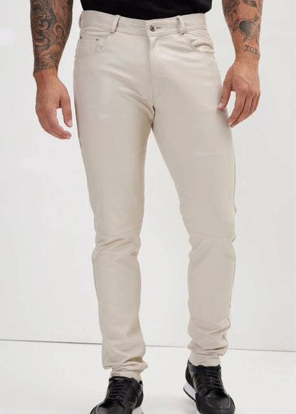 Person wearing beige pants on a white background