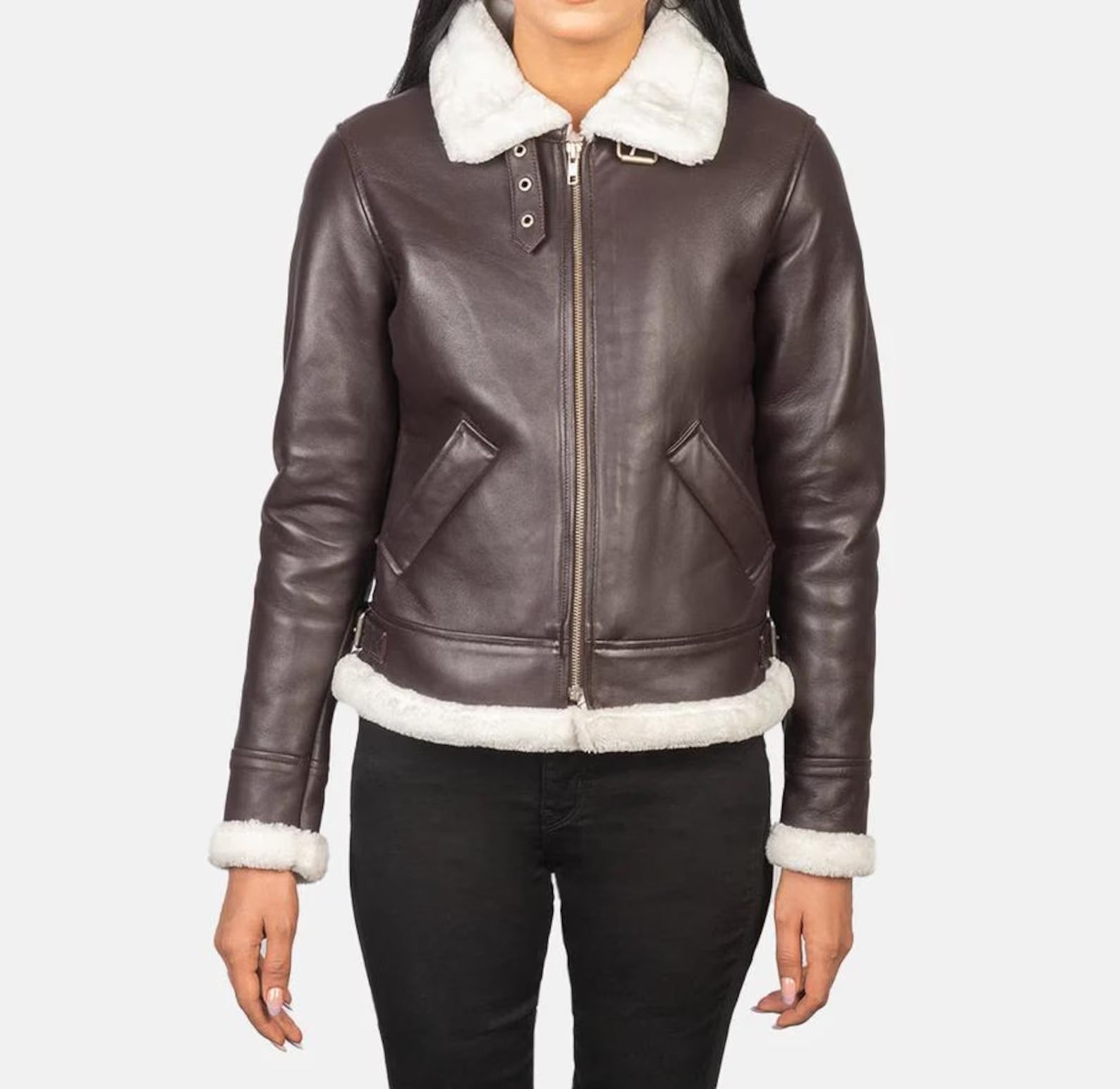 Brown leather jacket with white fur trim on a plain background