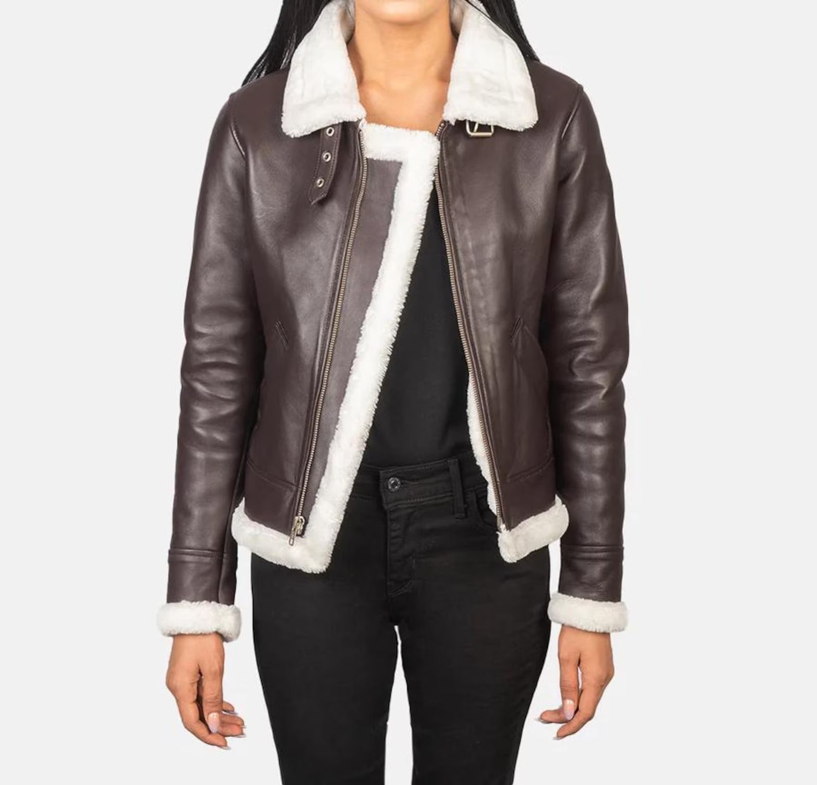 Brown leather jacket with white fur lining worn by a person on a plain background