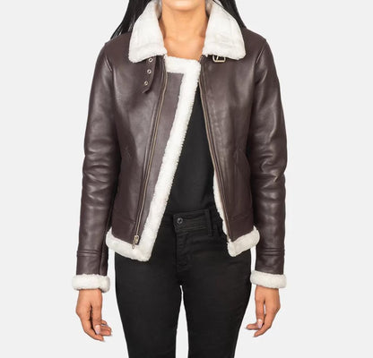 Brown leather jacket with white fur lining worn by a person on a plain background