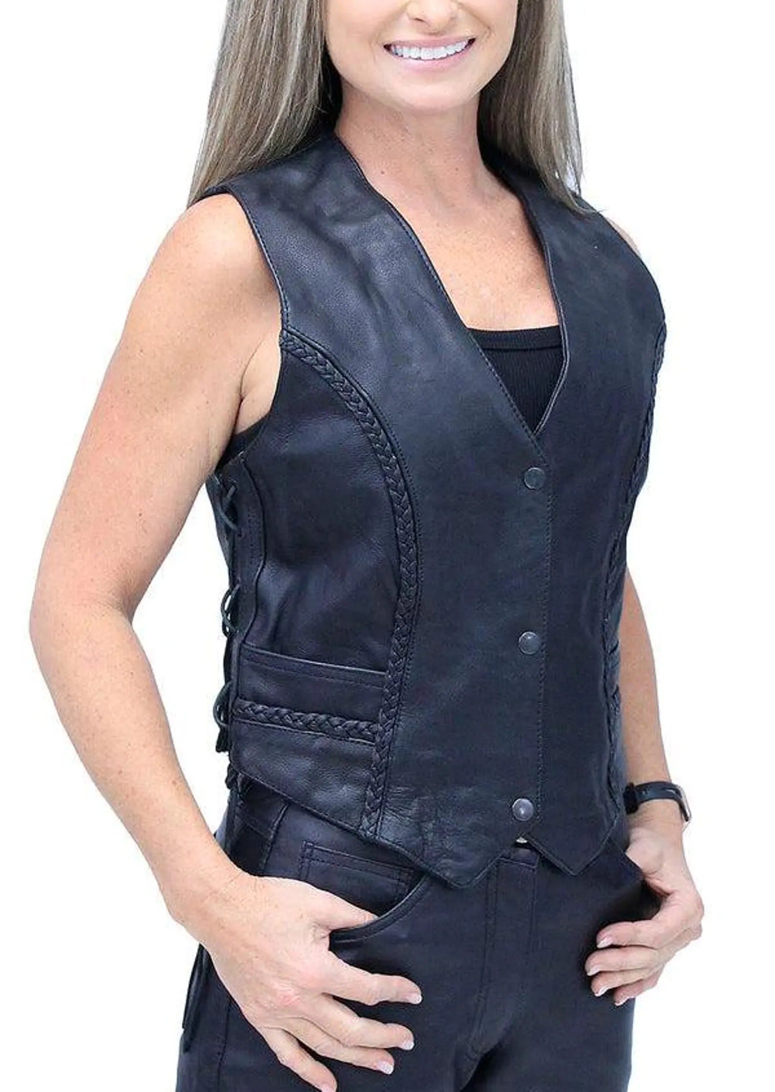 Woman wearing a black leather vest on a white background