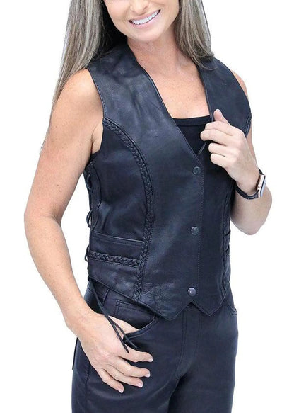 Woman wearing a black leather vest on a white background