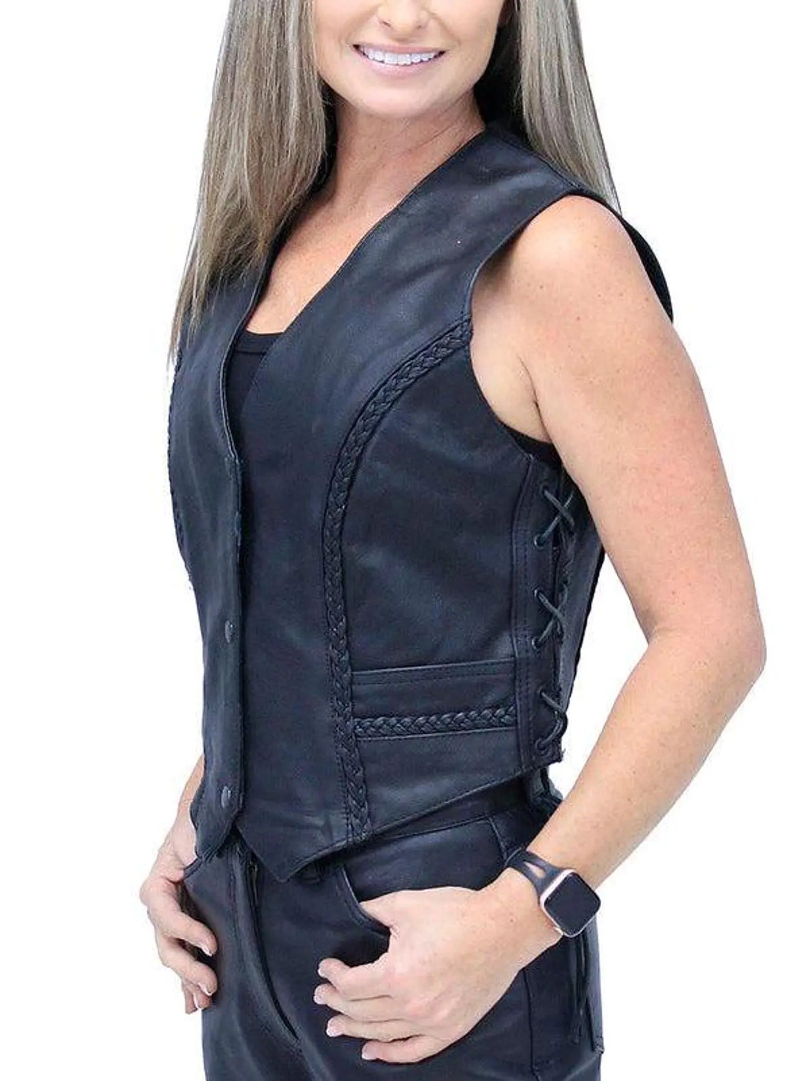 Woman wearing a black leather vest on a white background